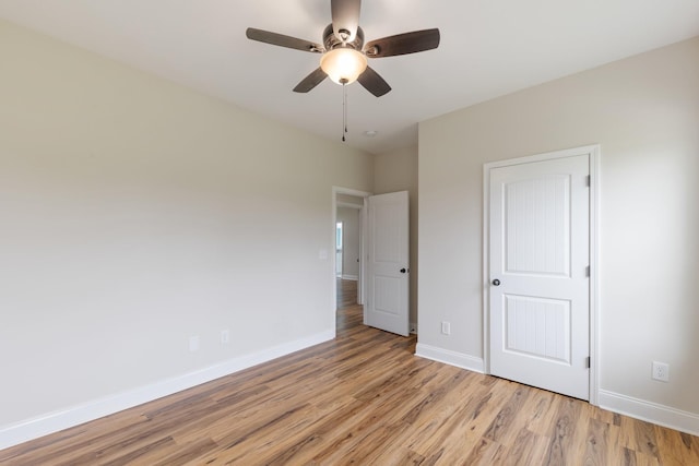 258 Jesse Dr, Pleasant View, TN 37146 - unfurnished bedroom with light wood-style flooring, baseboards, and ceiling fan