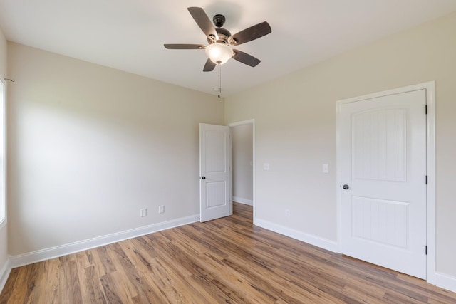 258 Jesse Dr, Pleasant View, TN 37146 - empty room with wood finished floors, ceiling fan, and baseboards