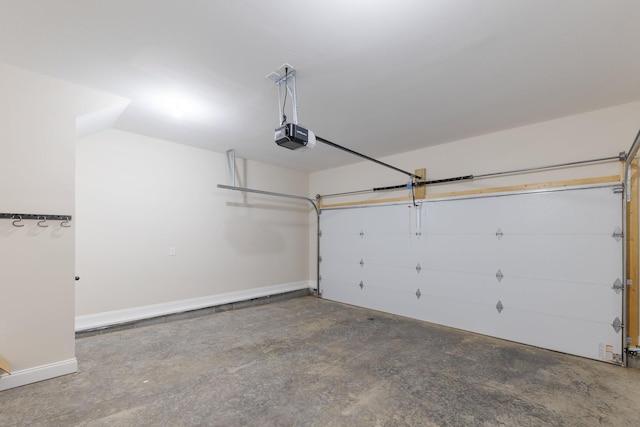 258 Jesse Dr, Pleasant View, TN 37146 - garage with a garage door opener and baseboards