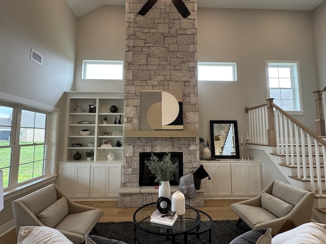 4109 Fargo Ct, Murfreesboro, TN 37127 - living room with high vaulted ceiling, healthy amount of natural light, a fireplace, and light wood-style floors