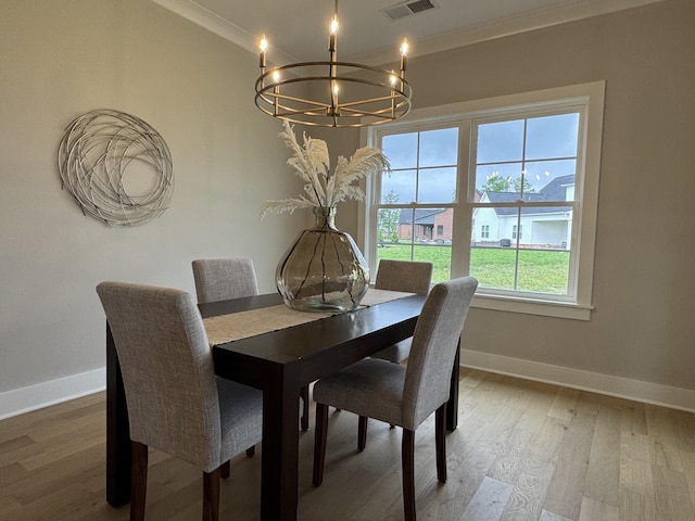 4109 Fargo Ct, Murfreesboro, TN 37127 - dining space featuring a chandelier, baseboards, wood finished floors, and ornamental molding