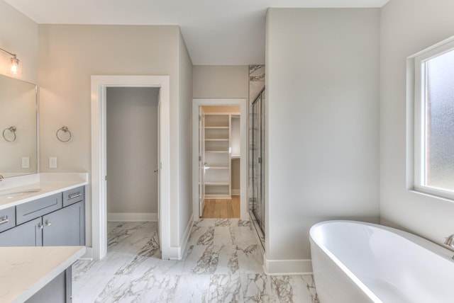 4109 Fargo Ct, Murfreesboro, TN 37127 - bathroom featuring marble look tile flooring, a stall shower, a soaking tub, vanity, and baseboards