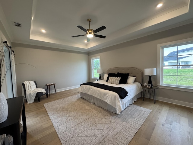 4109 Fargo Ct, Murfreesboro, TN 37127 - bedroom featuring a tray ceiling, baseboards, wood finished floors, ornamental molding, and a ceiling fan
