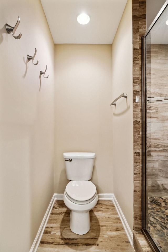 2506 Morgan Rd, Murfreesboro, TN 37129 - full bathroom with a shower stall, toilet, wood finished floors, and baseboards
