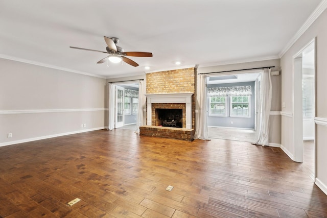 2506 Morgan Rd, Murfreesboro, TN 37129 - unfurnished living room featuring plenty of natural light, ceiling fan, a brick fireplace, wood finished floors, and ornamental molding