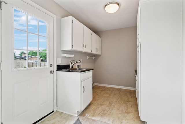 2506 Morgan Rd, Murfreesboro, TN 37129 - laundry room featuring washer hookup, cabinet space, and baseboards