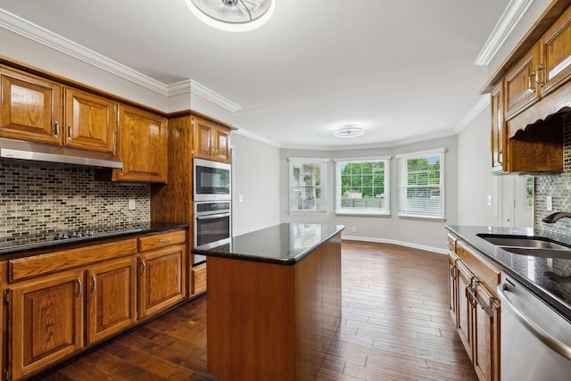 2506 Morgan Rd, Murfreesboro, TN 37129 - kitchen featuring stainless steel appliances, a sink, under cabinet range hood, ornamental molding, and backsplash