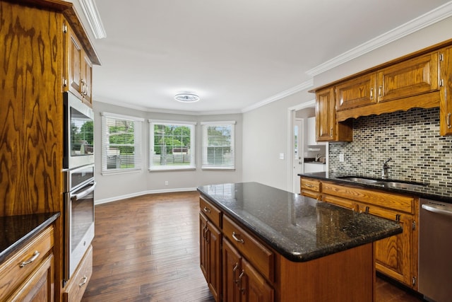 2506 Morgan Rd, Murfreesboro, TN 37129 - kitchen featuring stainless steel appliances, ornamental molding, backsplash, a sink, and dark wood finished floors