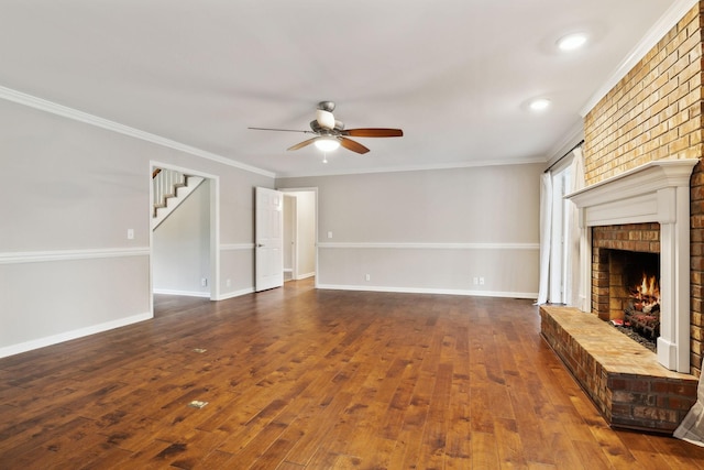 2506 Morgan Rd, Murfreesboro, TN 37129 - unfurnished living room featuring a ceiling fan, a fireplace, hardwood / wood-style floors, stairway, and crown molding