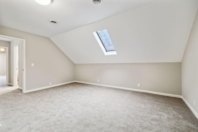 2506 Morgan Rd, Murfreesboro, TN 37129 - additional living space with vaulted ceiling, carpet, a skylight, and baseboards