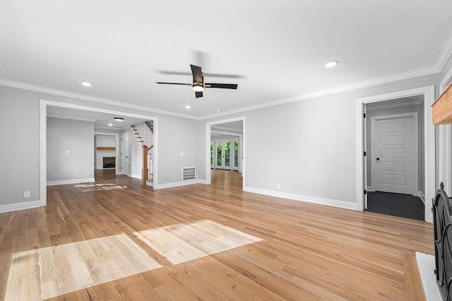 1311 Halifax Ct, Murfreesboro, TN 37130 - unfurnished living room featuring a ceiling fan, light wood finished floors, crown molding, baseboards, and recessed lighting
