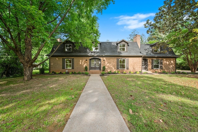 1311 Halifax Ct, Murfreesboro, TN 37130 - view of property featuring a chimney, brick siding, a front lawn, and a shingled roof
