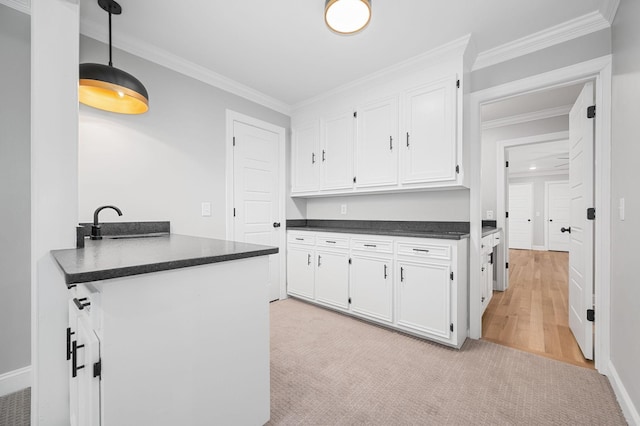 1311 Halifax Ct, Murfreesboro, TN 37130 - kitchen with dark countertops, white cabinetry, a sink, baseboards, and ornamental molding