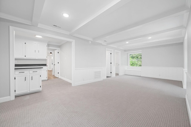1311 Halifax Ct, Murfreesboro, TN 37130 - unfurnished living room featuring light carpet, beam ceiling, recessed lighting, a wainscoted wall, and ornamental molding
