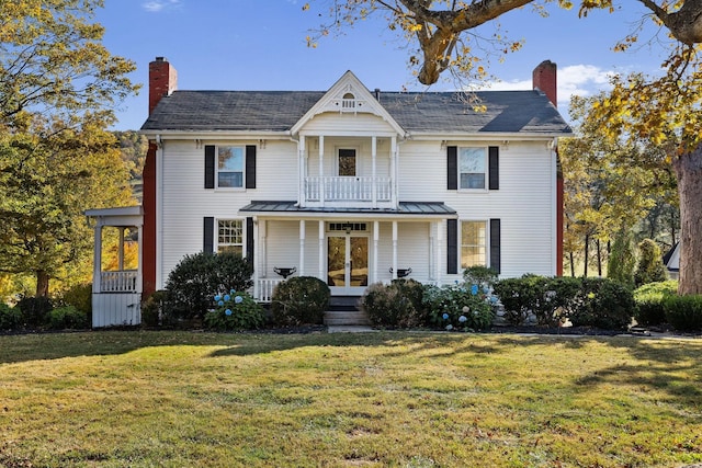 2133 Allisona Rd, Eagleville, TN 37060 - view of front of home featuring a chimney, covered porch, a front lawn, and a balcony