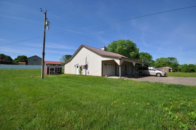 5620 Sango Rd, Clarksville, TN 37043 - view of side of home with an outdoor structure, a garage, metal roof, driveway, and a shed