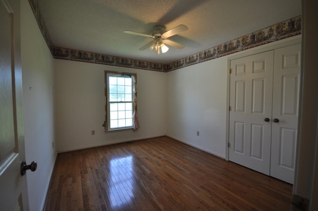 5620 Sango Rd, Clarksville, TN 37043 - spare room with hardwood / wood-style floors, a ceiling fan, a textured ceiling, and baseboards