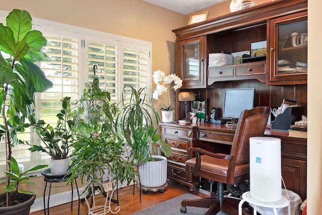 home office with wood finished floors