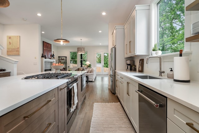 1411B Boscobel St, Nashville, TN 37206 - kitchen featuring appliances with stainless steel finishes, a sink, light countertops, recessed lighting, and hardwood / wood-style flooring