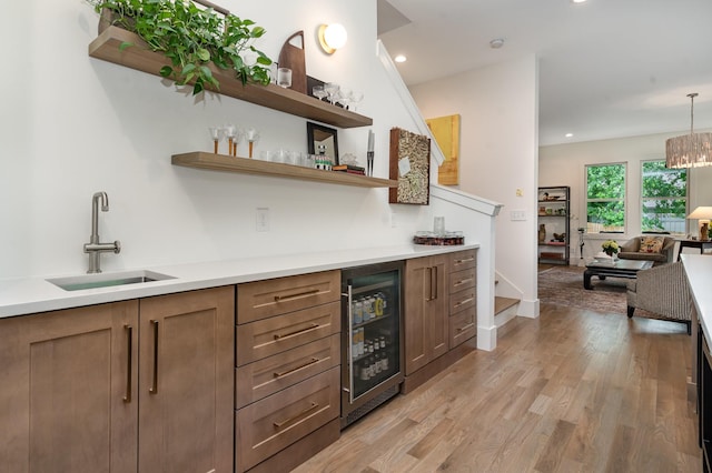 1411B Boscobel St, Nashville, TN 37206 - indoor dry bar with wine cooler, light wood finished floors, recessed lighting, decorative light fixtures, and baseboards