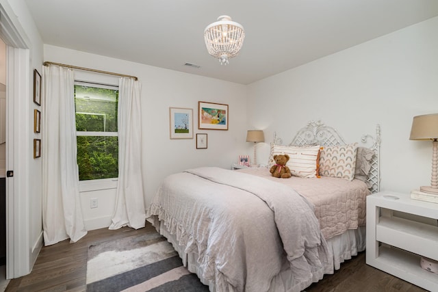 1411B Boscobel St, Nashville, TN 37206 - bedroom with wood finished floors, a chandelier, and baseboards