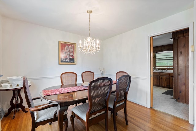511 Catalina Dr, Nashville, TN 37217 - dining space with a chandelier, light wood-style flooring, and baseboards