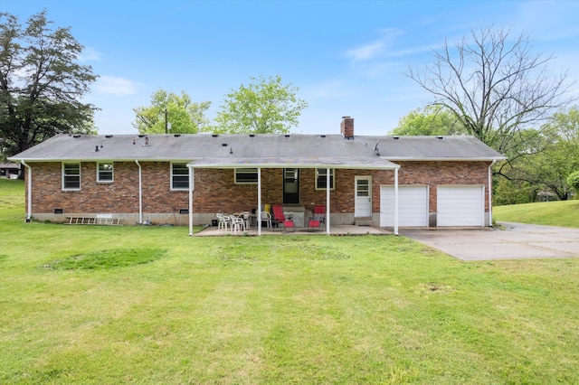 511 Catalina Dr, Nashville, TN 37217 - back of property with concrete driveway, brick siding, a chimney, and a patio