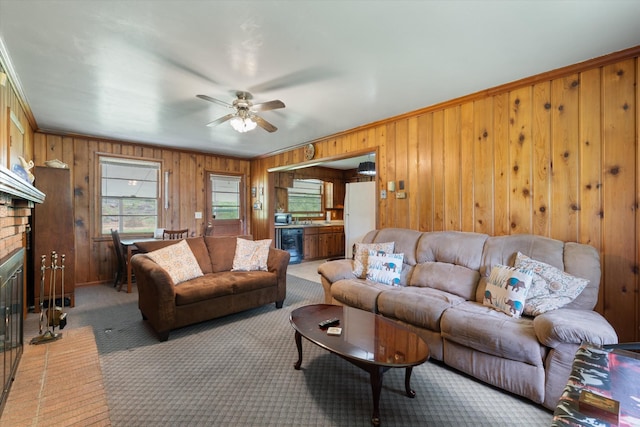511 Catalina Dr, Nashville, TN 37217 - living area with beverage cooler, wood walls, ceiling fan, light carpet, and crown molding