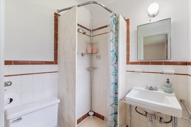 511 Catalina Dr, Nashville, TN 37217 - full bath with tile walls, tiled shower, toilet, and a sink