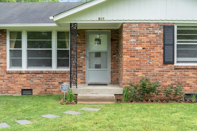 511 Catalina Dr, Nashville, TN 37217 - view of exterior entry featuring crawl space, brick siding, and a yard