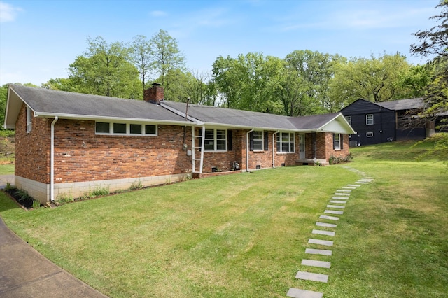 511 Catalina Dr, Nashville, TN 37217 - view of front of property with a front yard, brick siding, a chimney, and roof with shingles