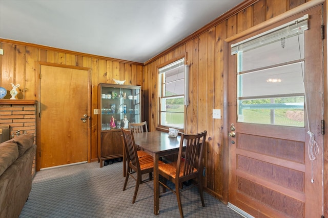 511 Catalina Dr, Nashville, TN 37217 - dining area featuring wooden walls, ornamental molding, and carpet