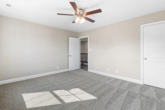 unfurnished bedroom featuring carpet, baseboards, and a ceiling fan