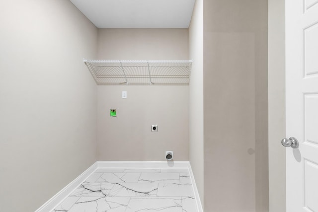 washroom with hookup for an electric dryer, hookup for a washing machine, marble finish floors, and baseboards