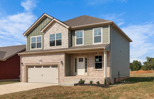 craftsman inspired home with concrete driveway, an attached garage, board and batten siding, a front lawn, and brick siding