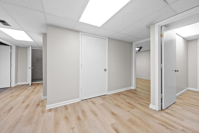 938 Merritt Lewis Ln, Clarksville, TN 37042 - finished basement with a drop ceiling, wood finished floors, and baseboards