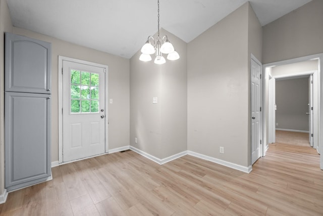 938 Merritt Lewis Ln, Clarksville, TN 37042 - unfurnished dining area with a chandelier, light wood-type flooring, baseboards, and vaulted ceiling