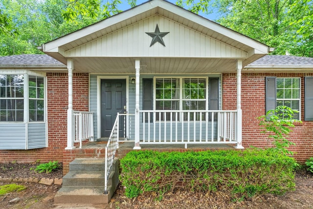 938 Merritt Lewis Ln, Clarksville, TN 37042 - view of front of property featuring brick siding, a shingled roof, and a porch