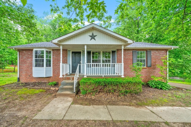 938 Merritt Lewis Ln, Clarksville, TN 37042 - single story home with covered porch, brick siding, and a shingled roof