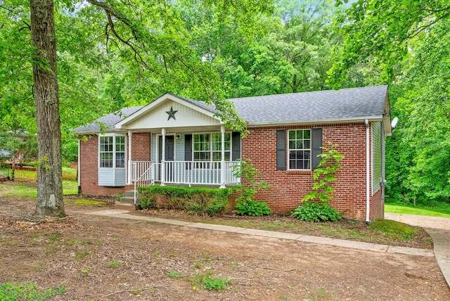 938 Merritt Lewis Ln, Clarksville, TN 37042 - ranch-style house with brick siding, covered porch, and roof with shingles