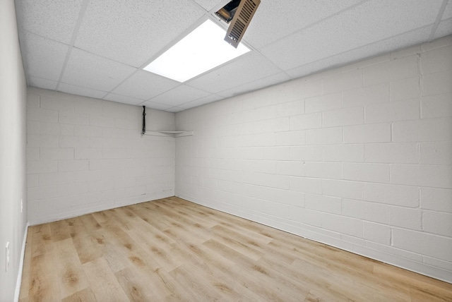 938 Merritt Lewis Ln, Clarksville, TN 37042 - finished below grade area featuring a paneled ceiling, concrete block wall, and wood finished floors