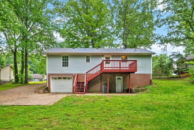 938 Merritt Lewis Ln, Clarksville, TN 37042 - rear view of house featuring stairway, driveway, a deck, a lawn, and brick siding