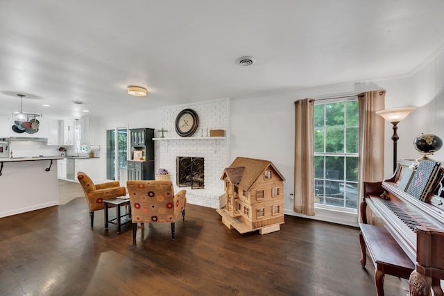 1033 Percy Warner Blvd, Nashville, TN 37205 - living room featuring dark wood-style floors, a brick fireplace, and baseboards