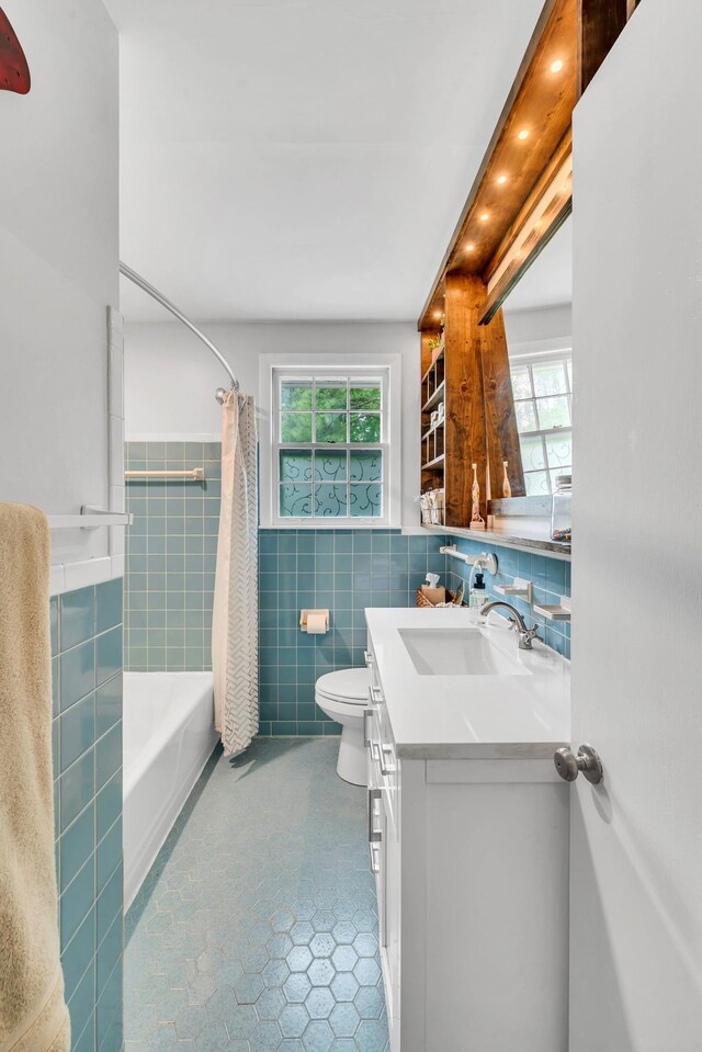 1033 Percy Warner Blvd, Nashville, TN 37205 - bathroom featuring tile walls, tile patterned floors, toilet, healthy amount of natural light, and vanity