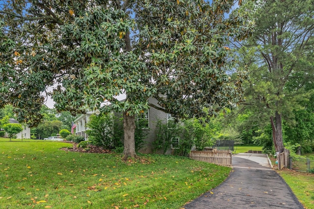 1033 Percy Warner Blvd, Nashville, TN 37205 - view of side of home featuring a yard and brick siding