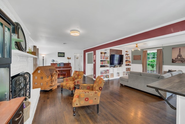 1033 Percy Warner Blvd, Nashville, TN 37205 - living area with wood finished floors, a fireplace, ornamental molding, a ceiling fan, and built in shelves