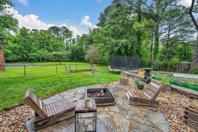 1033 Percy Warner Blvd, Nashville, TN 37205 - view of patio with a trampoline and a fire pit