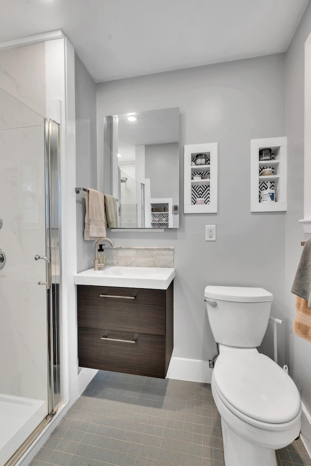 1033 Percy Warner Blvd, Nashville, TN 37205 - bathroom with baseboards, toilet, a shower stall, tile patterned flooring, and vanity