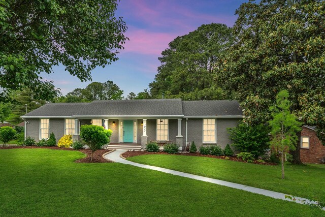 1033 Percy Warner Blvd, Nashville, TN 37205 - ranch-style house with a yard, brick siding, and a porch