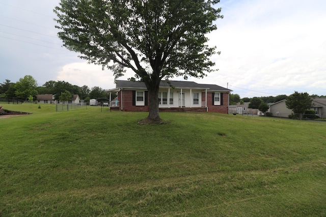ranch-style house featuring brick siding and covered porch